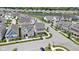 An aerial view showcasing a neighborhood of beautiful two-story homes with manicured lawns, near a serene lake at 1892 Ponsonby Dr, Westfield, IN 46074