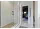 Bright bathroom showcasing a glass-enclosed shower with built-in bench and views of the bedroom at 1892 Ponsonby Dr, Westfield, IN 46074