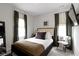 Cozy bedroom features calming decor, large windows, and ample natural light at 1892 Ponsonby Dr, Westfield, IN 46074