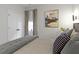 Inviting bedroom showcases a cozy bed with decorative pillows and modern wall art at 1892 Ponsonby Dr, Westfield, IN 46074