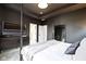 Sophisticated bedroom with a four-poster bed, dresser, and mirror, offering a comfortable retreat at 1892 Ponsonby Dr, Westfield, IN 46074