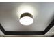 Close-up view of a modern ceiling light fixture with dark trim details in a neutral ceiling at 1892 Ponsonby Dr, Westfield, IN 46074