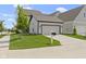 Charming home showcasing a manicured lawn and a private driveway at 1892 Ponsonby Dr, Westfield, IN 46074