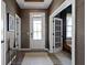 Foyer with wood floors, neutral color palette and a glass front door at 1892 Ponsonby Dr, Westfield, IN 46074