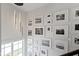 Hallway featuring gallery wall and abundant natural light from window at 1892 Ponsonby Dr, Westfield, IN 46074