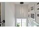 Bright hallway with modern pendant lighting and window view at 1892 Ponsonby Dr, Westfield, IN 46074