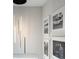 Bright hallway with modern pendant lighting and gallery wall of framed art at 1892 Ponsonby Dr, Westfield, IN 46074