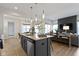 Contemporary kitchen with island overlooking living area and dining area at 1892 Ponsonby Dr, Westfield, IN 46074