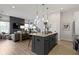 Open kitchen with island seating and view to the living room at 1892 Ponsonby Dr, Westfield, IN 46074