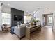 Open concept living room with modern fireplace and staircase at 1892 Ponsonby Dr, Westfield, IN 46074