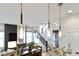 Modern living room with pendant lighting and staircase at 1892 Ponsonby Dr, Westfield, IN 46074