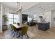 Open concept floorplan features dining area, living room and kitchen with an island and staircase at 1892 Ponsonby Dr, Westfield, IN 46074