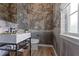 Chic powder room featuring patterned wallpaper, marble sink, and modern fixtures at 1892 Ponsonby Dr, Westfield, IN 46074
