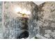 Stylish powder room with decorative wallpaper, elegant lighting, and a modern mirror at 1892 Ponsonby Dr, Westfield, IN 46074
