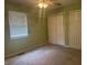 Bedroom with carpet floors, ceiling fan, and a window bringing in lots of light at 1919 Manor Dr, Lebanon, IN 46052