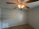 Bedroom featuring neutral walls, comfortable carpet, and a ceiling fan with lighting at 1919 Manor Dr, Lebanon, IN 46052