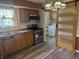 Kitchen area with stainless steel appliances and barn door to laundry at 1919 Manor Dr, Lebanon, IN 46052