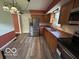 Kitchen featuring stainless steel appliances, wood cabinets and hardwood flooring at 1919 Manor Dr, Lebanon, IN 46052