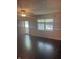 Open living room with hardwood floors, plenty of light and ceiling fan at 1919 Manor Dr, Lebanon, IN 46052