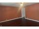 Cozy living room featuring dark hardwood floors and a ceiling fan at 1919 Manor Dr, Lebanon, IN 46052