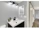 This bathroom features a modern vanity and a sliding barn door at 217 W Burnside Ave, Fairland, IN 46126