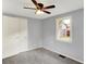 Bedroom features light gray walls, a ceiling fan, window and a closet at 217 W Burnside Ave, Fairland, IN 46126