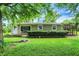 Charming single-story home featuring a welcoming front porch and a well-maintained, lush green lawn at 217 W Burnside Ave, Fairland, IN 46126