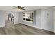 Inviting living room with modern flooring, neutral paint, and large windows offering plenty of natural light at 217 W Burnside Ave, Fairland, IN 46126