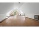 Spacious attic with pitched ceilings, hardwood floors, and natural light at 2421 W 39Th St, Indianapolis, IN 46228