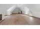Large attic space with pitched ceilings, hardwood floors, and natural light at 2421 W 39Th St, Indianapolis, IN 46228