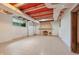Unfinished basement featuring a stone fireplace, tile floor, and single window at 2421 W 39Th St, Indianapolis, IN 46228