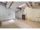 Unfinished basement with tile flooring, exposed ductwork, and fireplace at 2421 W 39Th St, Indianapolis, IN 46228