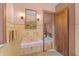 Pink sink bathroom features a medicine cabinet, floral motif towels, and vintage tile at 2421 W 39Th St, Indianapolis, IN 46228