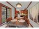 Dining room with a dark table, seating for six, lit by pendant, and large windows at 2421 W 39Th St, Indianapolis, IN 46228