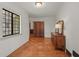 Hallway with hardwood floors and a large window allowing natural light at 2421 W 39Th St, Indianapolis, IN 46228