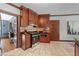 Updated kitchen featuring stainless steel appliances and dark wood cabinetry at 2421 W 39Th St, Indianapolis, IN 46228