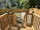 Newly built stairs and wood railing, leading to a fenced backyard at 2423 E 13Th St, Indianapolis, IN 46201
