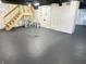 Unfinished basement with white walls, gray floor, and staircase at 2423 E 13Th St, Indianapolis, IN 46201