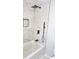 Stylish bathroom featuring a tiled shower and tub with modern fixtures and a recessed niche at 2423 E 13Th St, Indianapolis, IN 46201