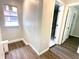 Bright hallway leading to a bathroom and bedroom, showcasing the home's layout and design at 2423 E 13Th St, Indianapolis, IN 46201