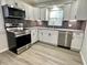 Contemporary kitchen with stainless steel appliances, stylish backsplash, and ample cabinet space at 2423 E 13Th St, Indianapolis, IN 46201