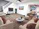 Stylishly staged living room with a modern entertainment center, comfy seating and decor at 2423 E 13Th St, Indianapolis, IN 46201
