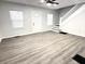 Bright and airy living room with modern gray floors and ample natural light at 2423 E 13Th St, Indianapolis, IN 46201