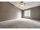 Neutral bedroom featuring a large window allowing for plenty of natural light at 246 Legends Creek Way # Apt 207, Indianapolis, IN 46229