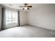 Bright bedroom with large window, neutral carpet, and ceiling fan, perfect for relaxing at 246 Legends Creek Way # Apt 207, Indianapolis, IN 46229