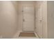 Clean entryway featuring neutral walls, white trim, a new doormat, and a secure-looking front door at 246 Legends Creek Way # Apt 207, Indianapolis, IN 46229