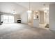 Spacious living room with a fireplace, large sliding glass doors, and plush carpeting at 246 Legends Creek Way # Apt 207, Indianapolis, IN 46229