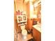 Cozy bathroom featuring a toilet, sink, vanity, and cabinet, designed for functionality at 2638 S Mcclure St, Indianapolis, IN 46241