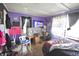 Comfortable bedroom featuring a TV, desk, with wood floors and personal decor creating a personalized space at 2638 S Mcclure St, Indianapolis, IN 46241