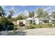 Charming single story home with a driveway and a detached garage in a residential neighborhood at 2638 S Mcclure St, Indianapolis, IN 46241